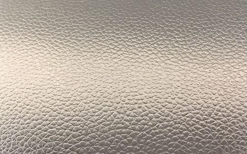 Textured emboss stainless steel press plate